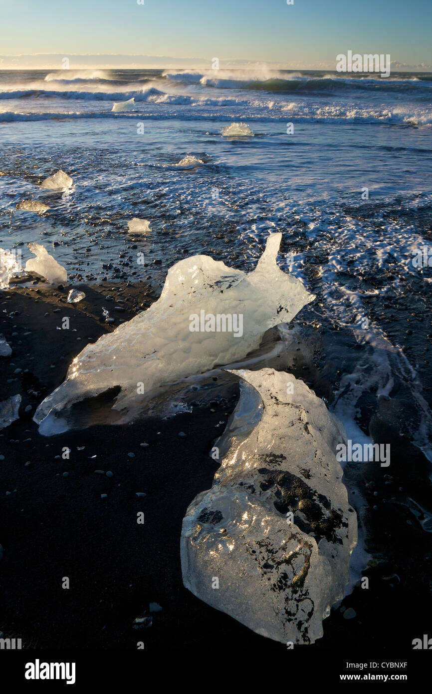 Icebergs on volcanic sand beach at Jokulsarlon Iceland Stock Photo
