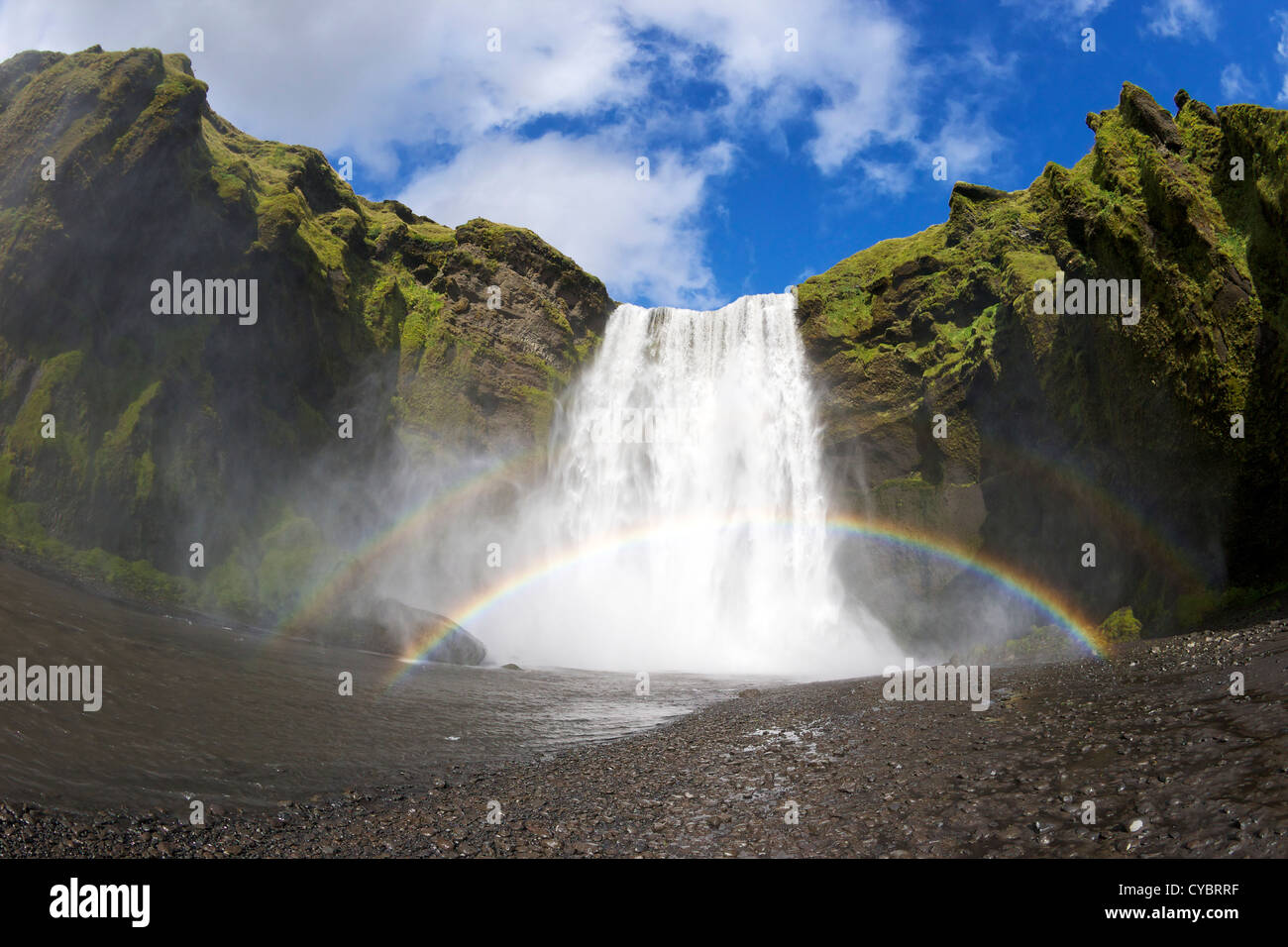 Skogafoss waterfall with double rainbow in summer sunshine, South coast, Iceland Stock Photo