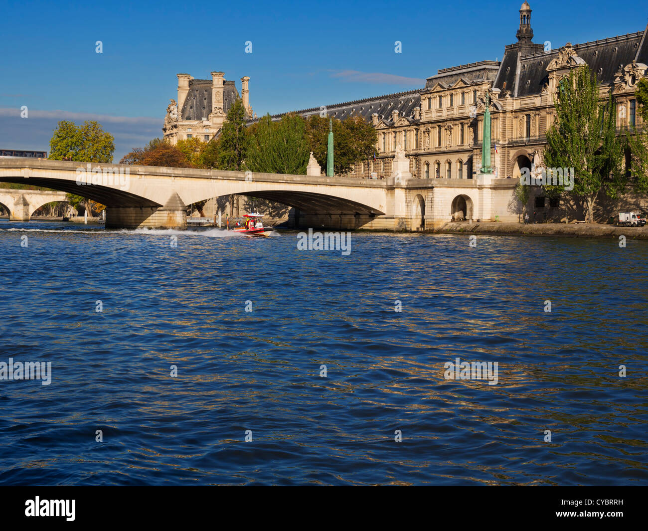 Fire Services rescue boat on the Seine River, Paris. Firemen on a rescue boat practice on the Seine in front of the Louvre. Stock Photo