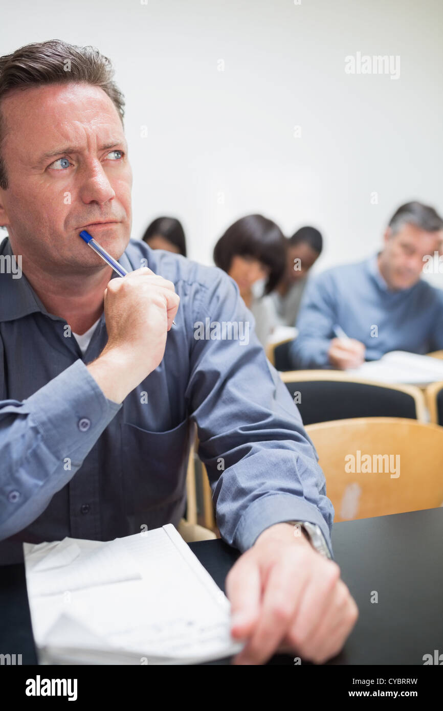 Mature student thinking in class Stock Photo Alamy