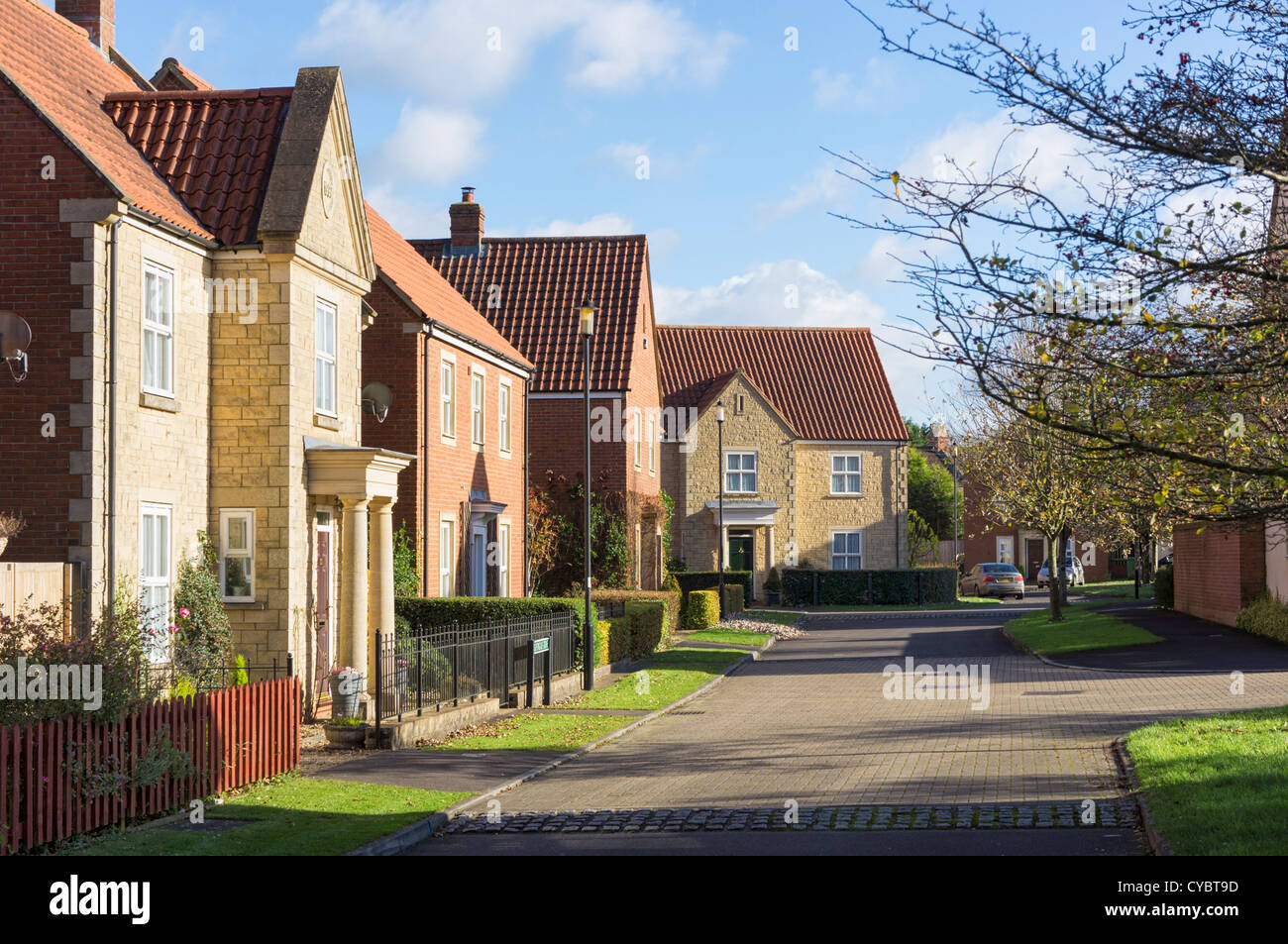 A typical British modern residential housing estate development and street, England, UK - Duchy of Cornwall development Stock Photo