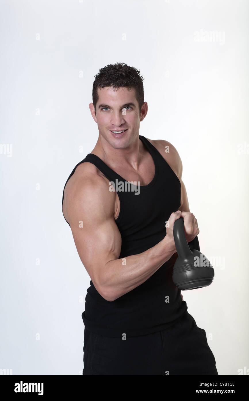 male bodybuilding doing a work out lifting kettlebell Stock Photo Alamy