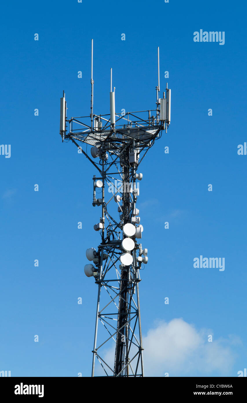 Telecommunications tower with aerials and dishes Stock Photo