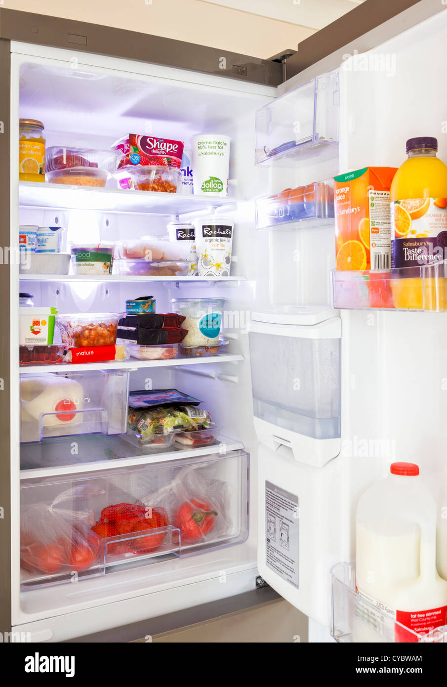 Inside a fridge with the door open Stock Photo