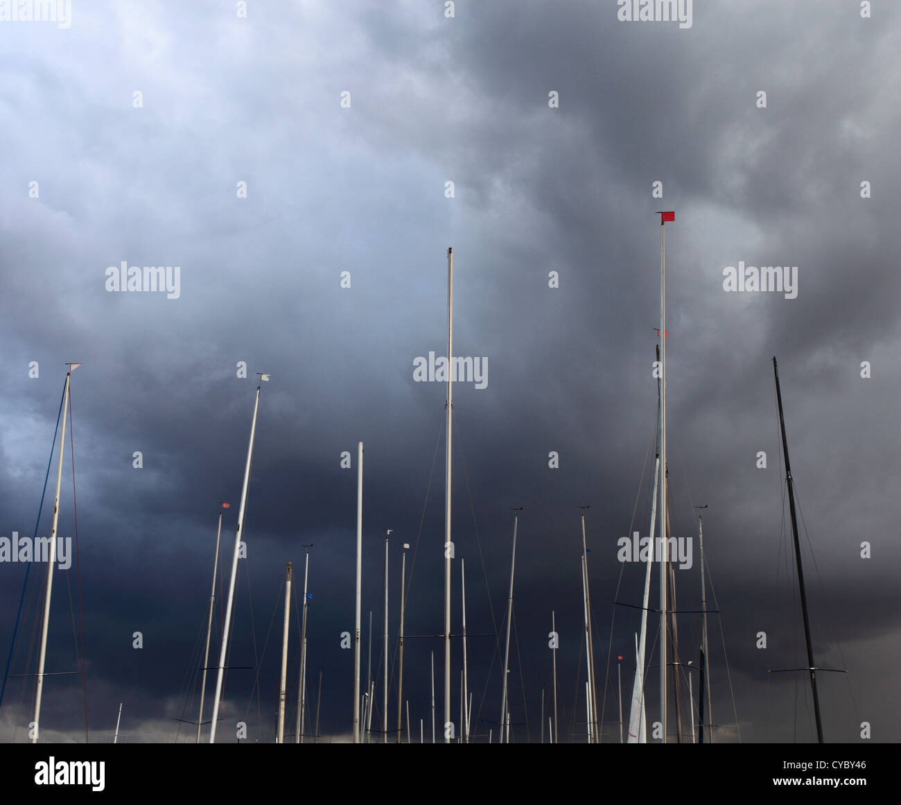 Boat masts against a stormy sky. Stock Photo