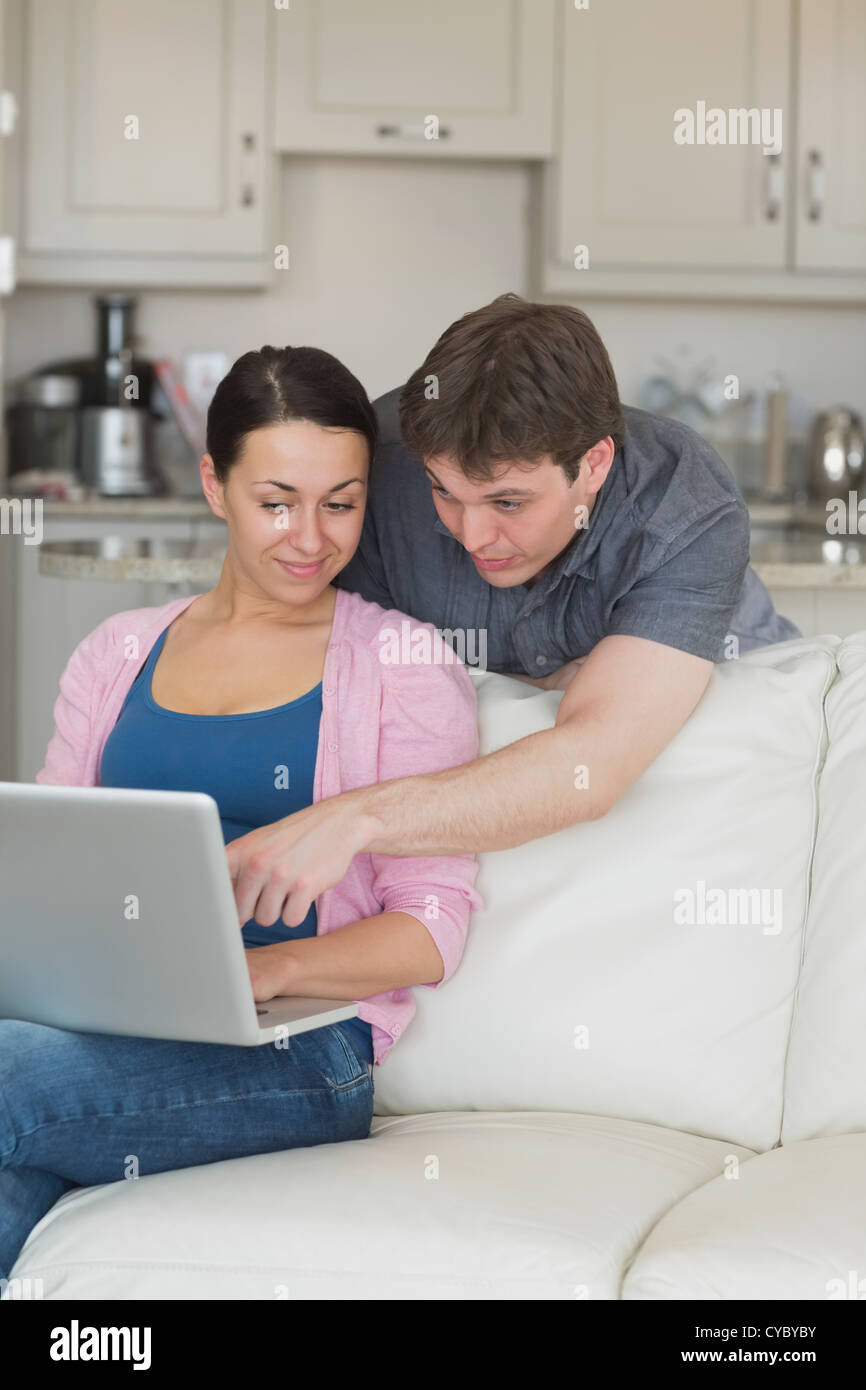Young couple using the laptop Stock Photo - Alamy