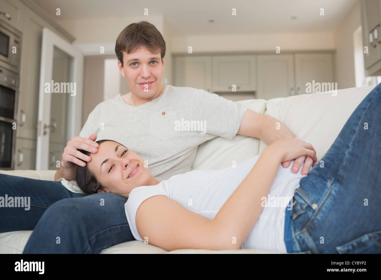 Prospective parents enjoying their time in the living room Stock Photo