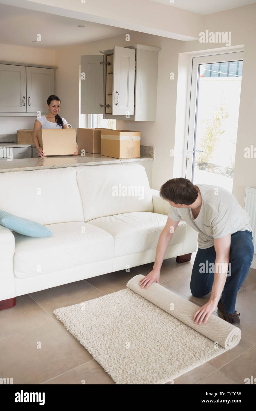 Young people furnishing the house Stock Photo Alamy