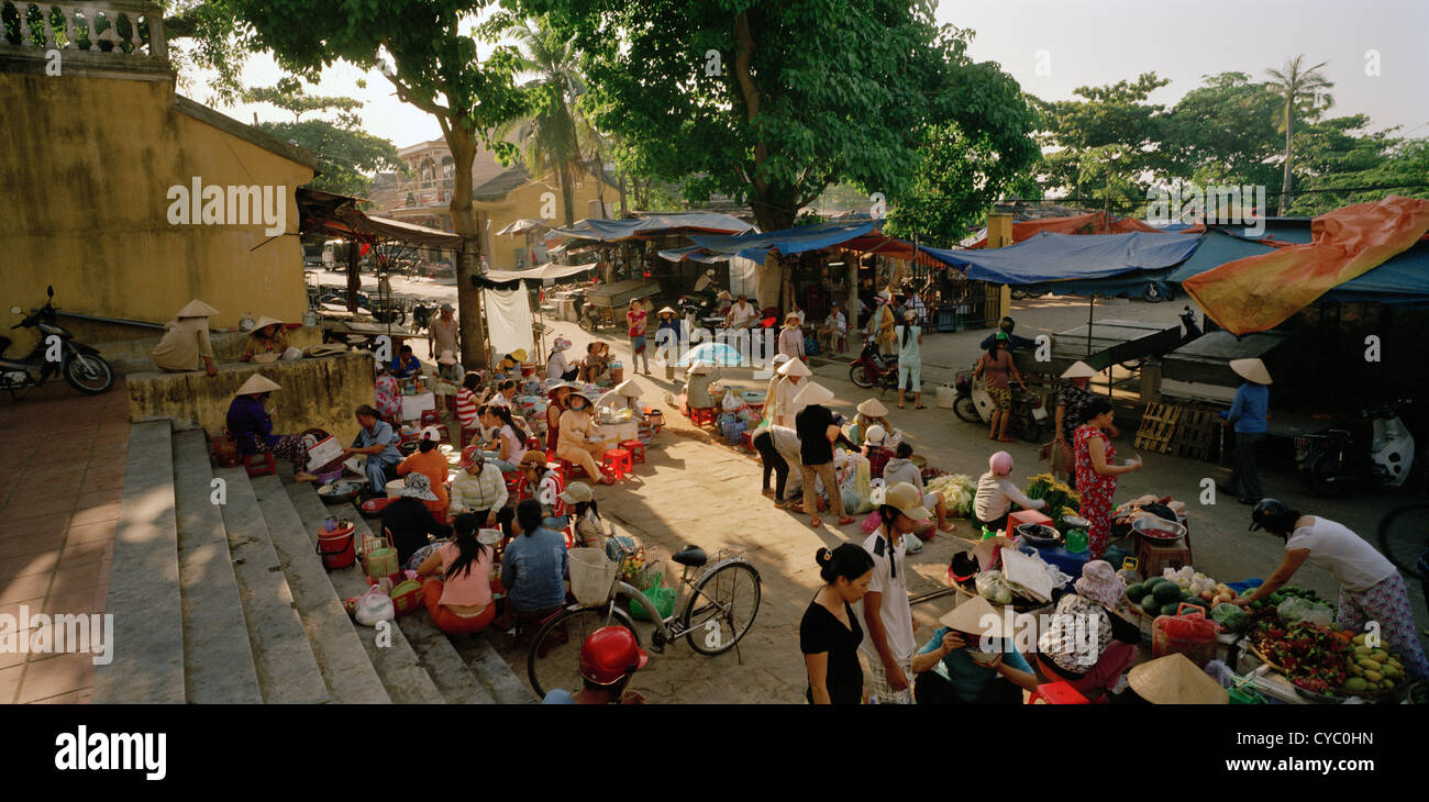 Traditional market street scene in Hoi An in Vietnam in Far East Southeast Asia. People Reportage Photojournalism Life Lifestyle Wanderlust Travel Stock Photo