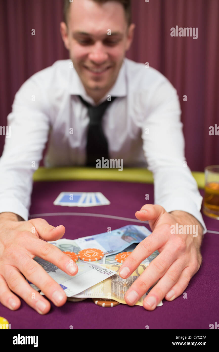 Man is happy grabbing money Stock Photo