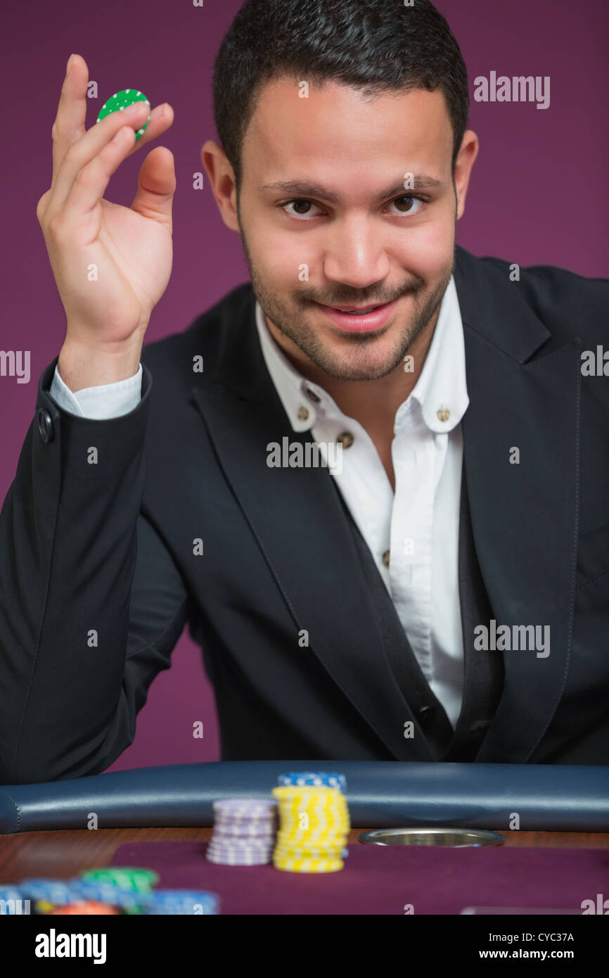 Holding between fingers hi-res stock photography and images - Alamy