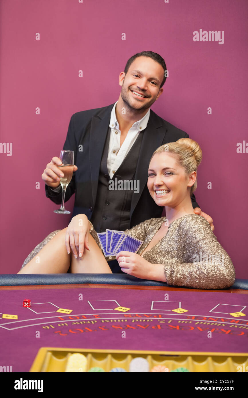 Happy couple at poker table Stock Photo