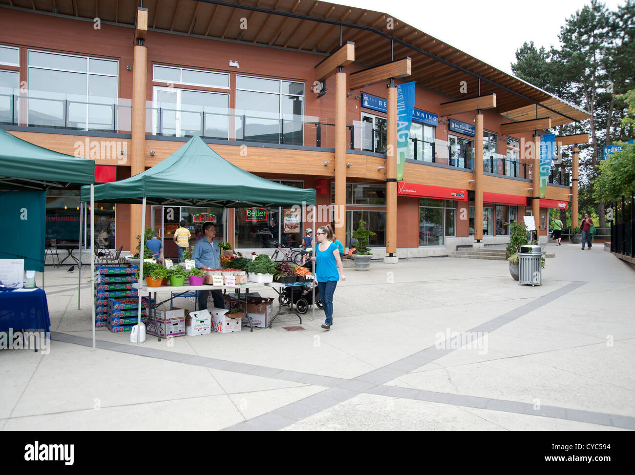 The public square with a farmer's market at Lynn Valley Centre, North