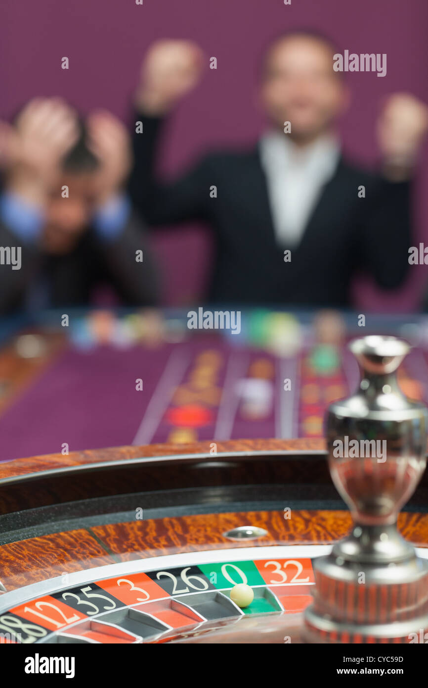 Loser and winner at roulette table Stock Photo
