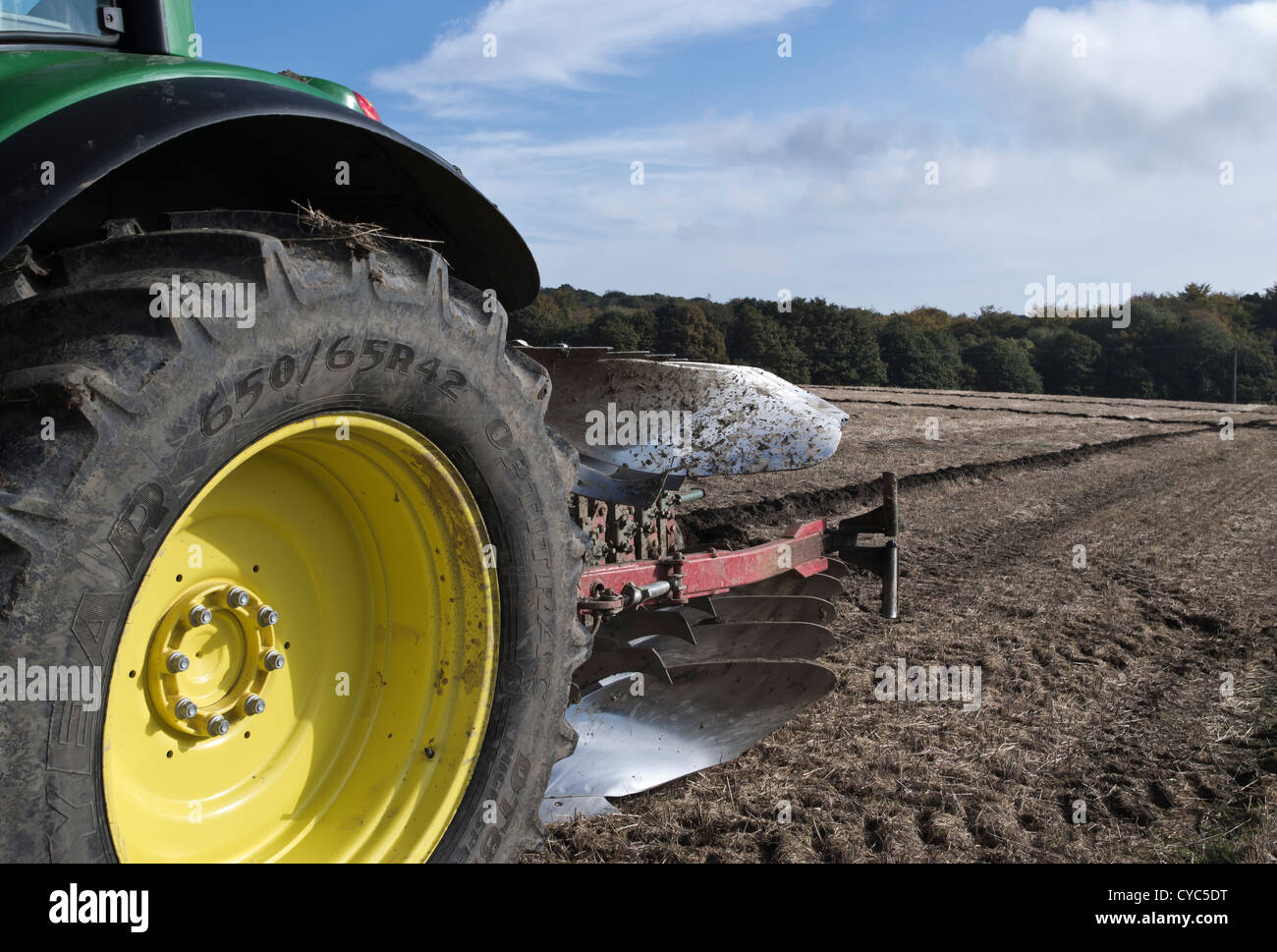 john deere tractor with reversible plough at ploughing match demonstration Stock Photo