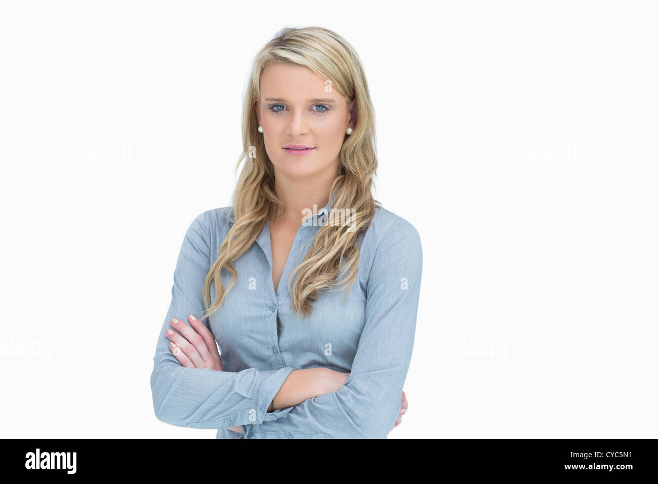 Blonde woman having arms crossed Stock Photo - Alamy