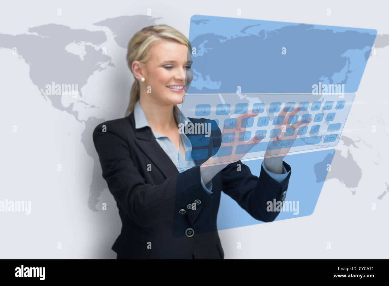 Business woman typing on holographic keyboard Stock Photo