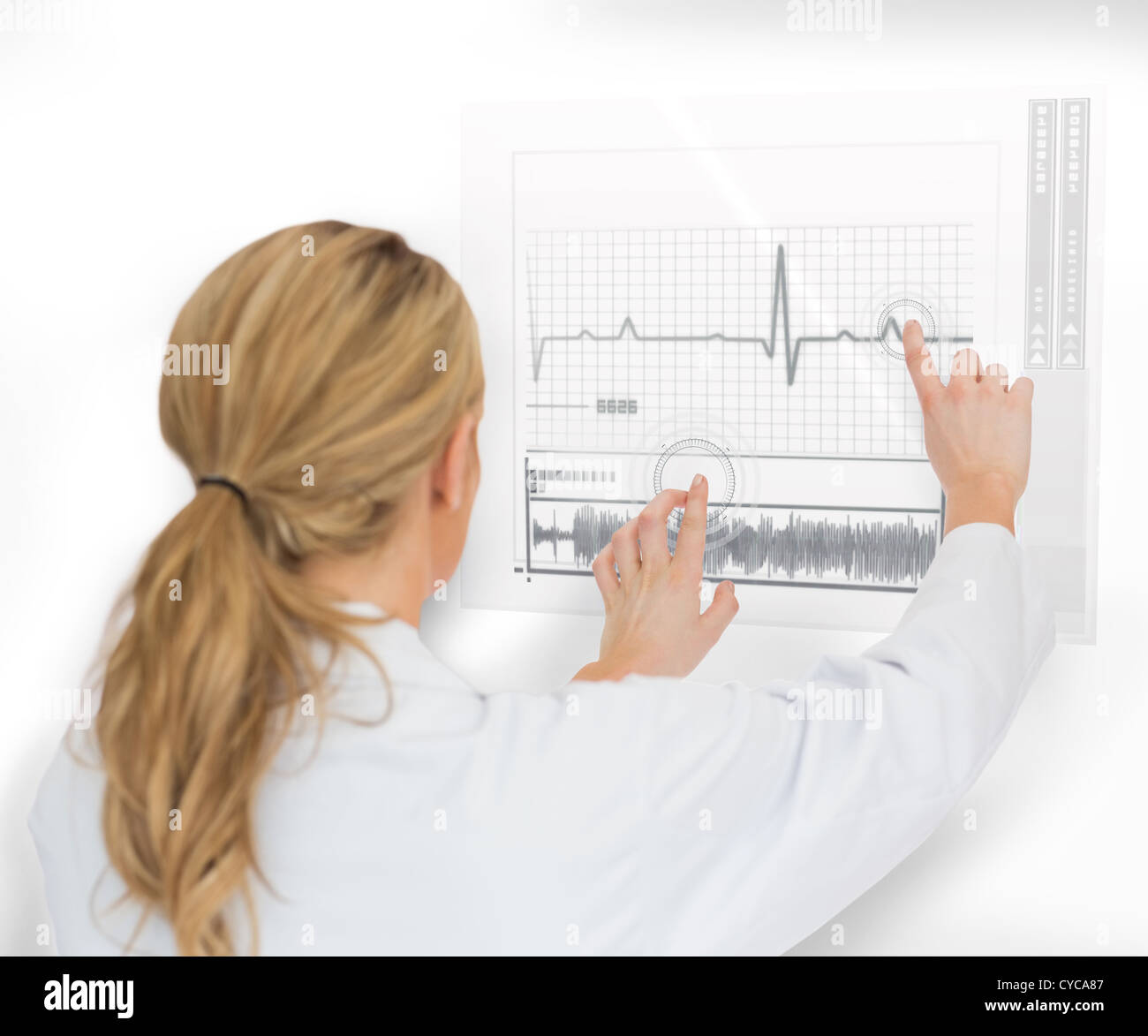 Doctor using heart rate interface Stock Photo