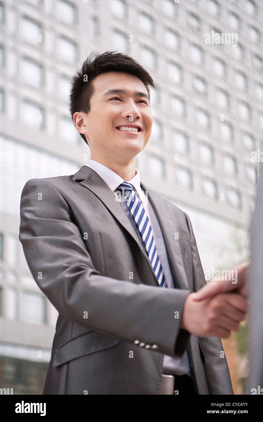 Businessman shaking hands Stock Photo Alamy