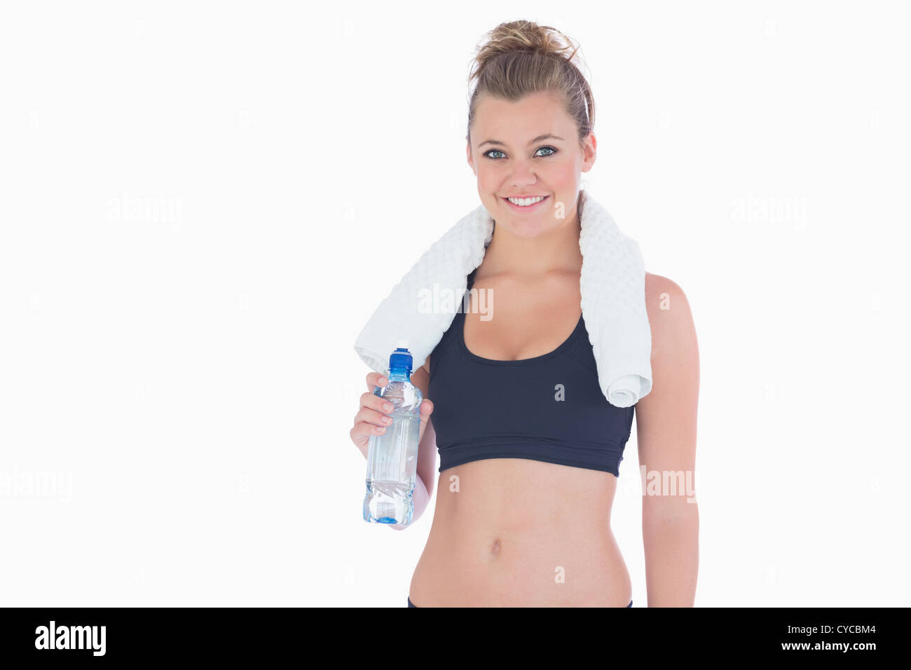 Woman smiling while holding a bottle of water Stock Photo - Alamy