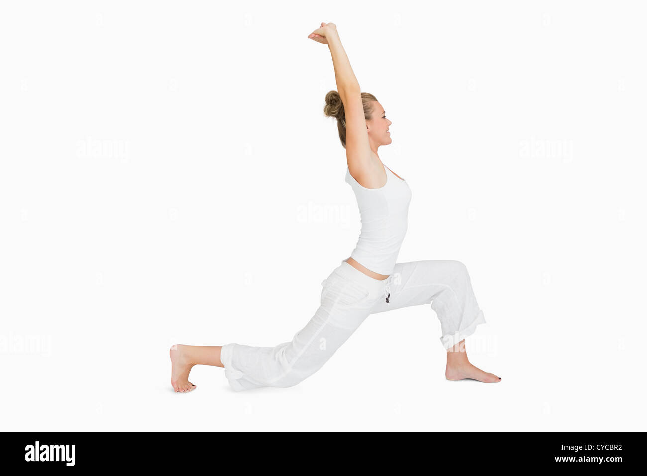 Woman in low lunge yoga pose Stock Photo - Alamy