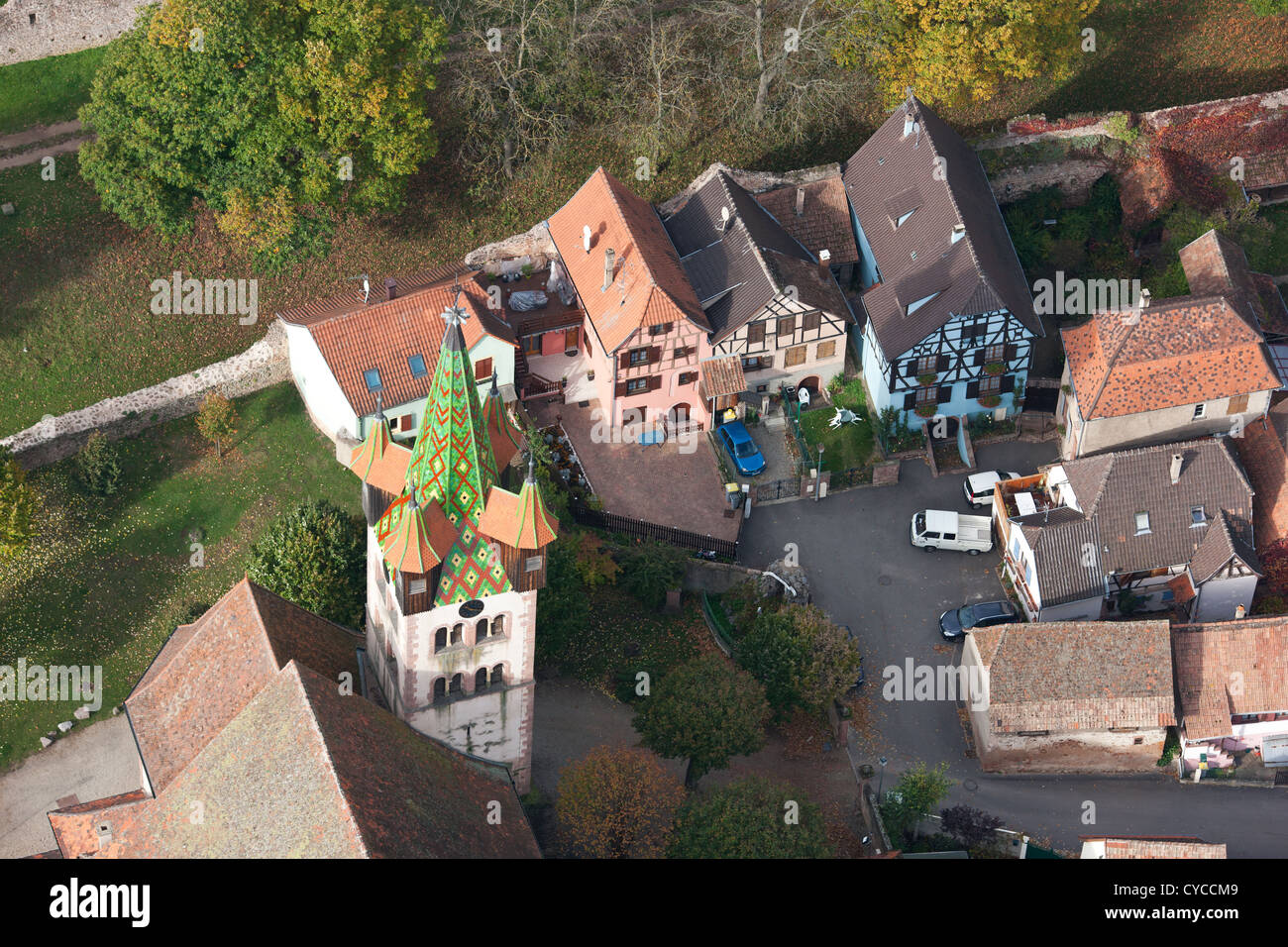 AERIAL VIEW. Steeple of Saint-Georges Church and traditional half-timbered homes. Châtenois. Bas-Rhin, Alsace, Grand Est, France. Stock Photo