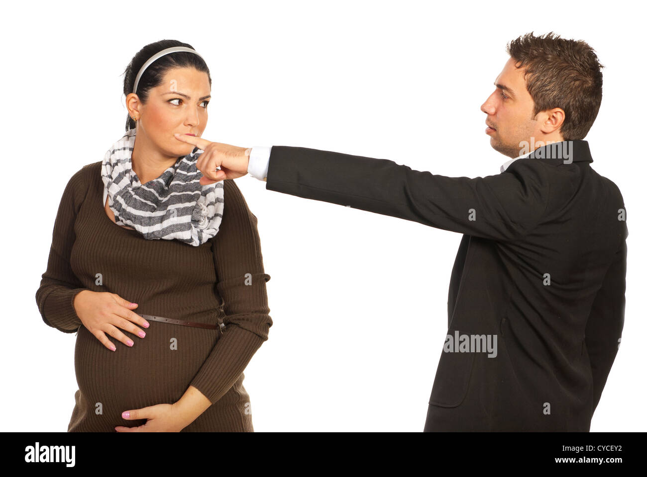 Pregnant sad woman is dismissed by her boss and invited to leave out isolated on white background Stock Photo