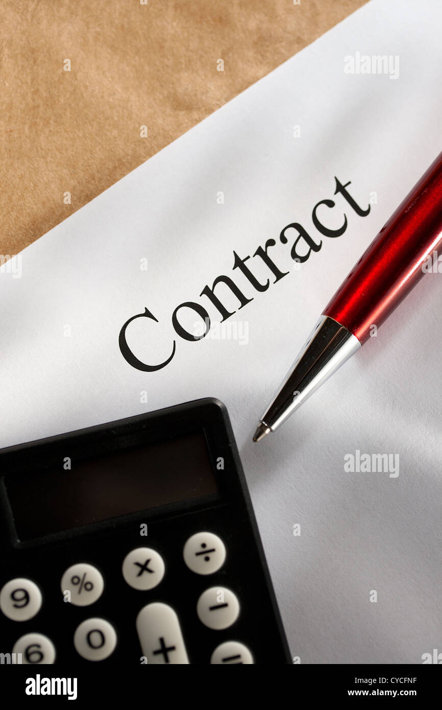 Contract conception with pen and calculator Stock Photo