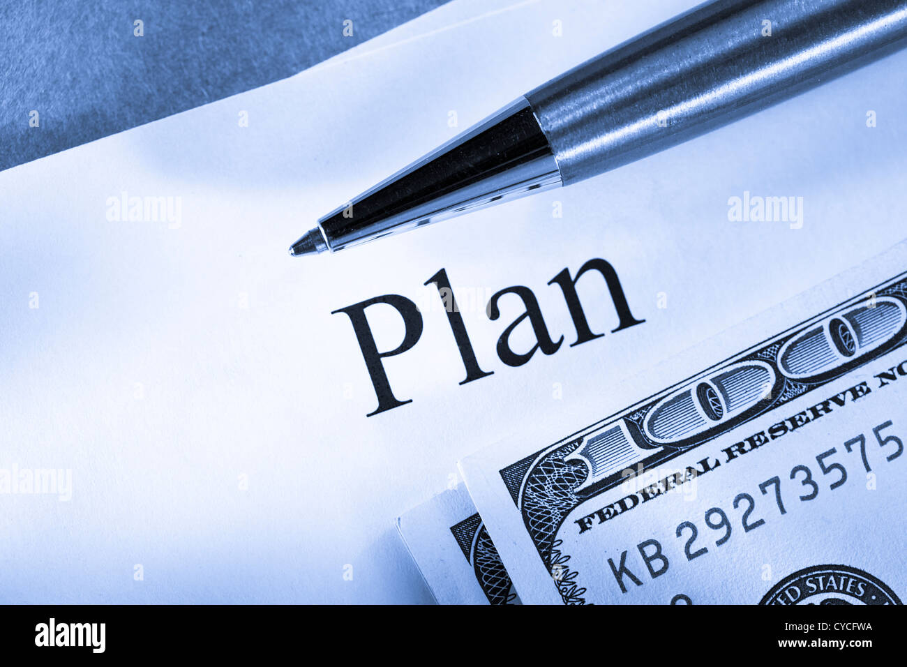 Plan conception with pen and money Stock Photo