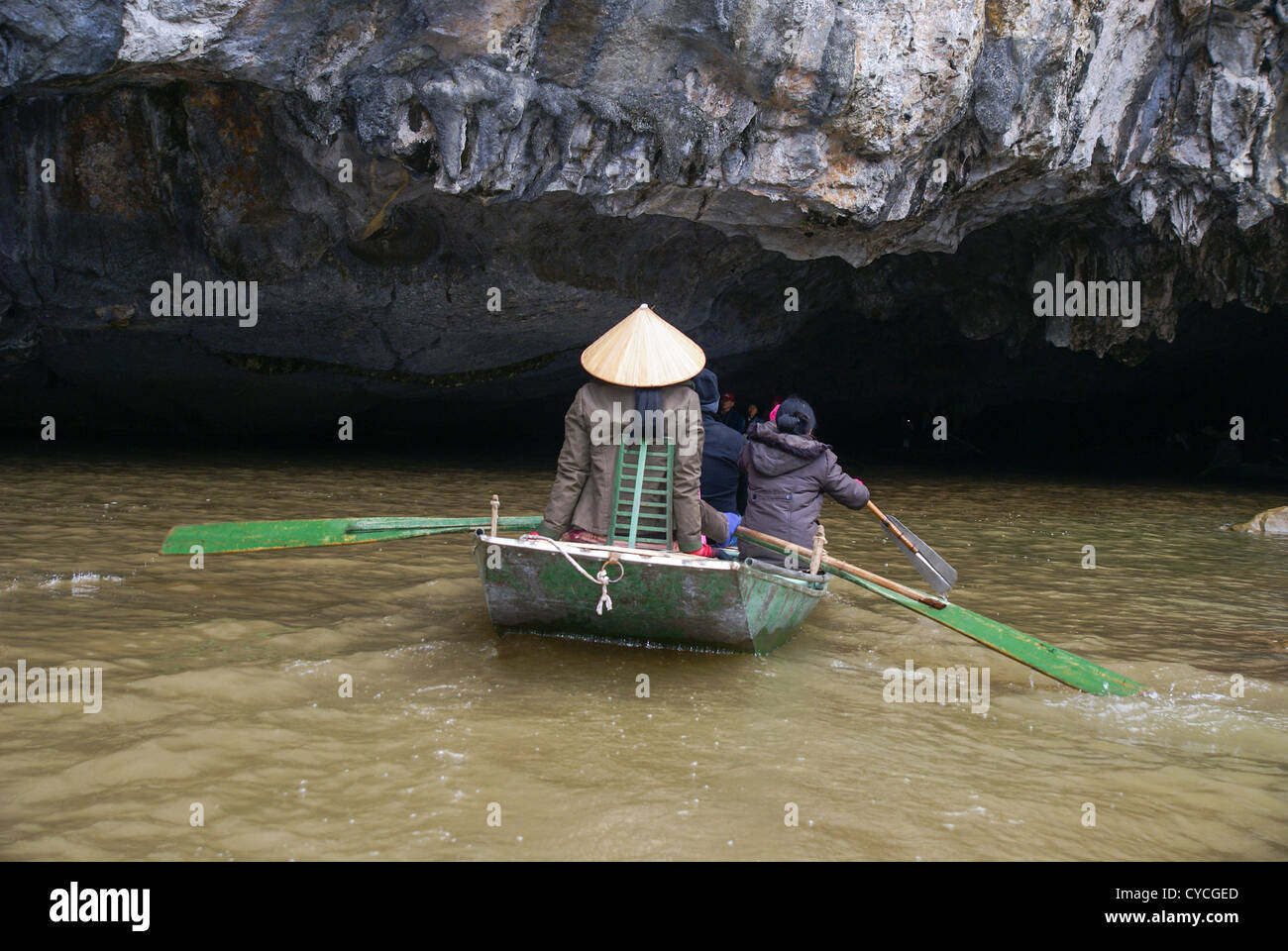 Foot rowing Tam Coc area of Ngo Dong River near Ninh Binh, Vietnam Stock Photo