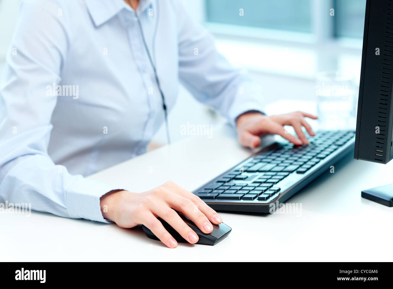Close-up of female hands during computer work Stock Photo - Alamy