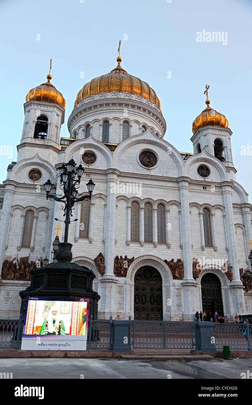 Orthodox priest preaching on giant screen outside the Cathedral of Christ the Saviour, Moscow Stock Photo