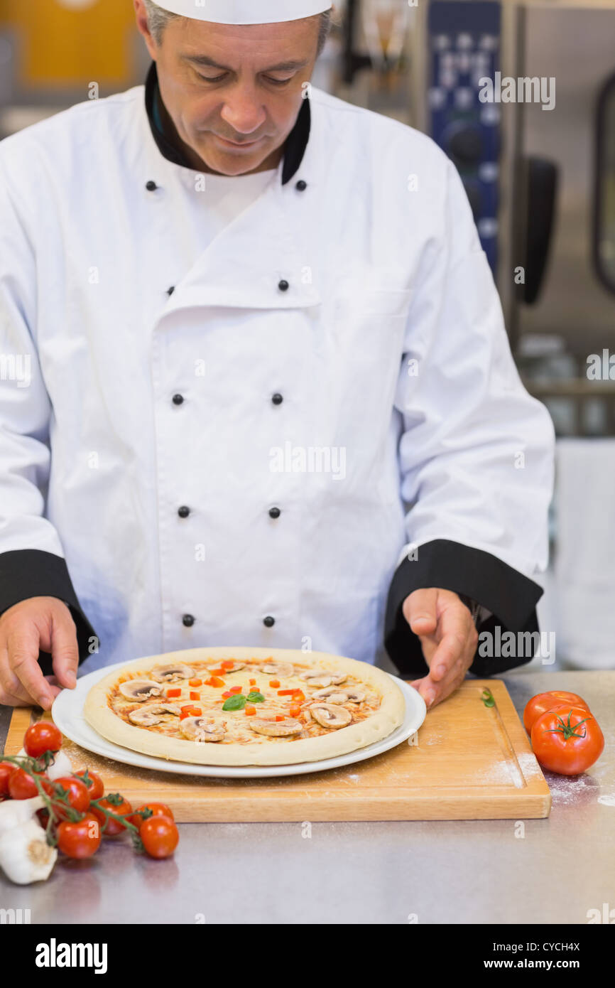 Chef preparing a mushroom pizza Stock Photo - Alamy