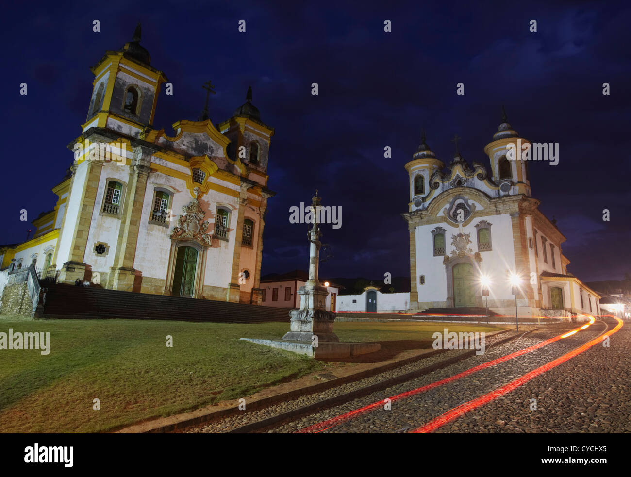 Our Lady of Carmo and Sao Francisco of Assis churches in Praca Minas Gerais at dusk, Mariana, Minas Gerais, Brazil Stock Photo