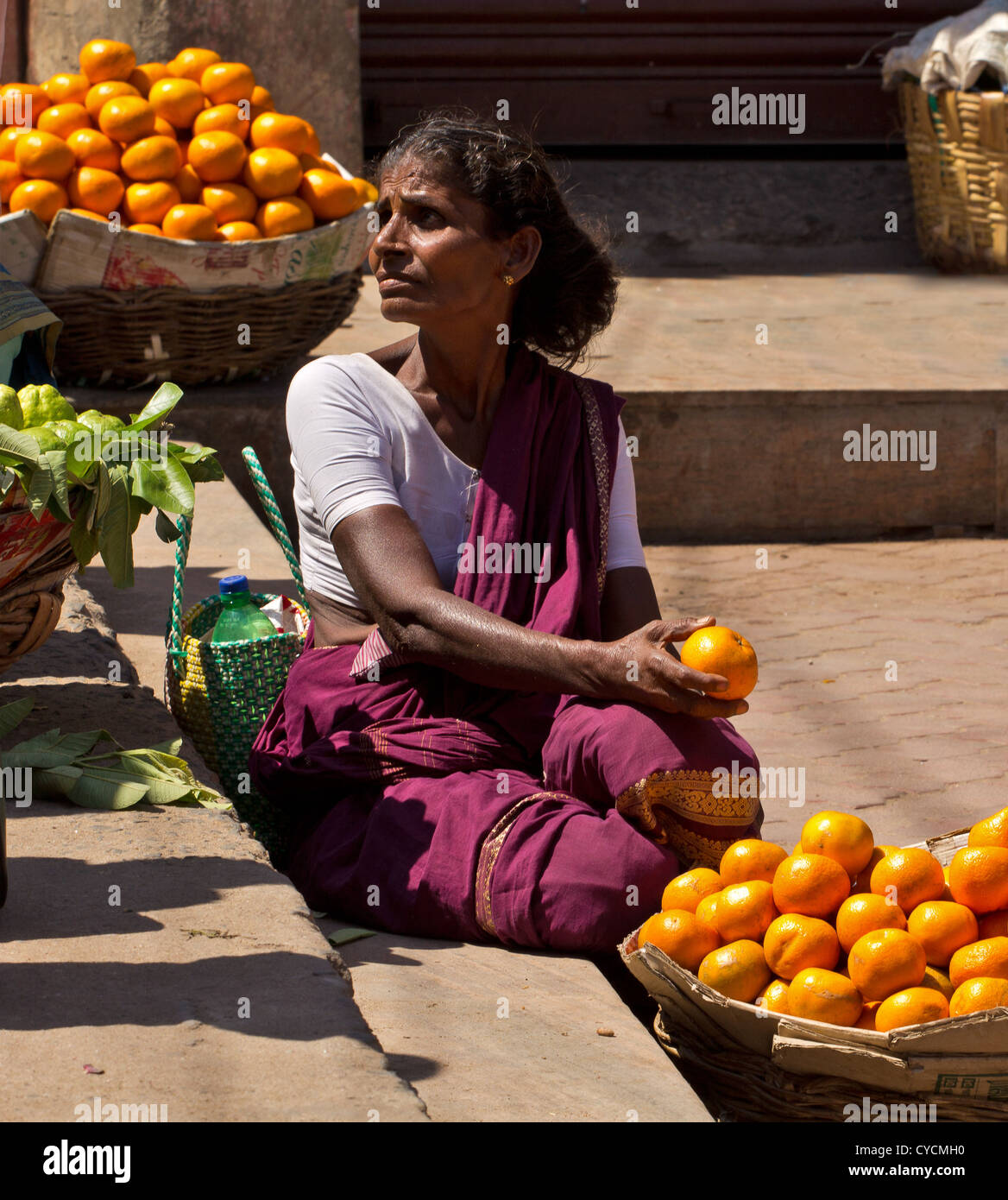 A SELLER OF ORANGES IN A MARKET IN MADURAI INDIA Stock Photo