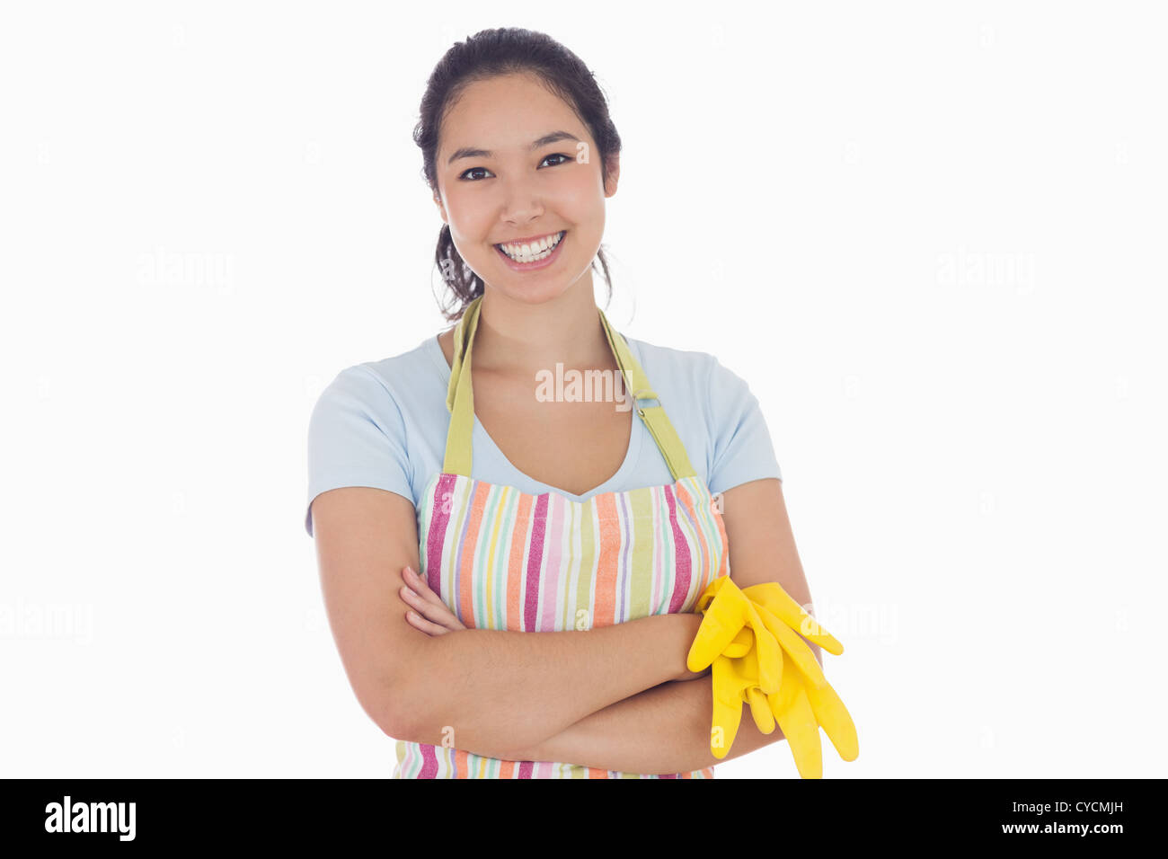 Woman smiling and holding rubber gloves Stock Photo - Alamy