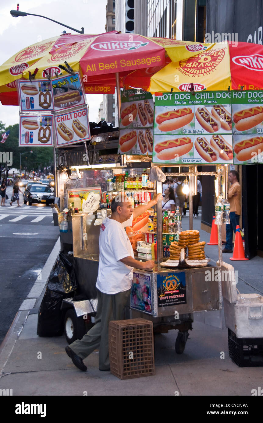 Hot-dogs and pretzels seller on Fifth Avenue - New York City, USA Stock Photo