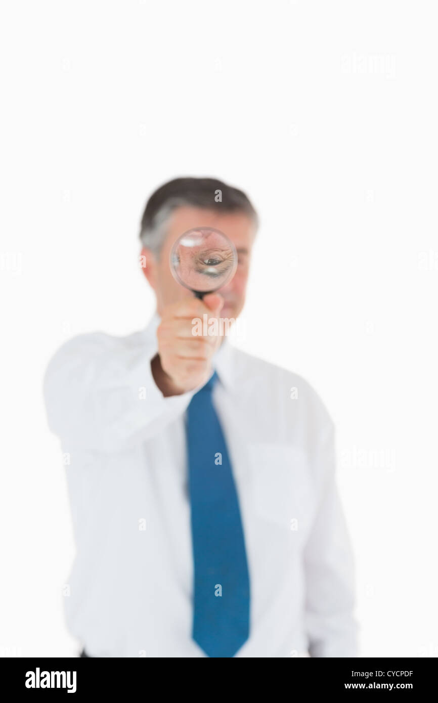 Businessman using a magnifying glass Stock Photo Alamy