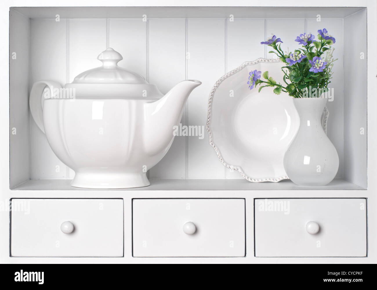 White shelf with vintage porcelain tableware Stock Photo