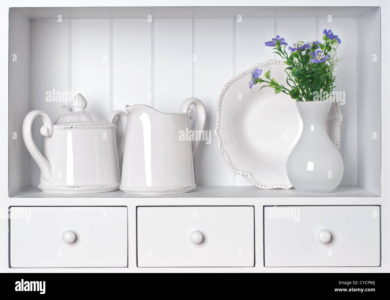 White shelf with vintage porcelain tableware Stock Photo