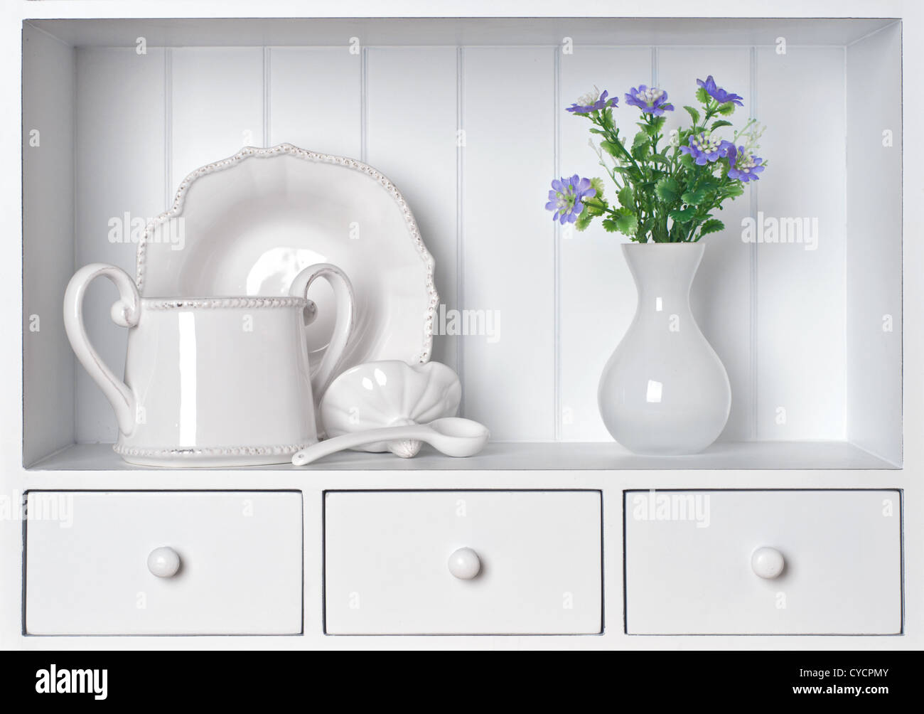 White shelf with vintage porcelain tableware Stock Photo
