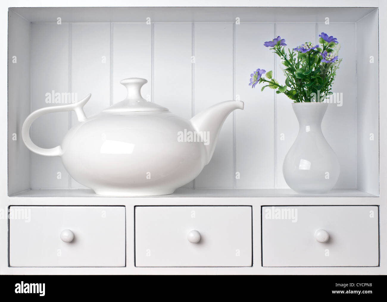 White shelf with vintage porcelain tableware Stock Photo