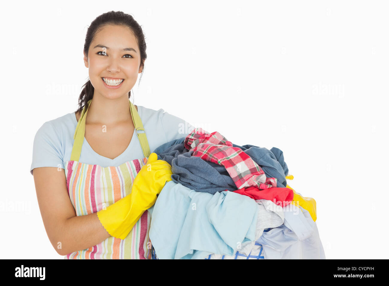 Laughing woman holding laundry basket Stock Photo
