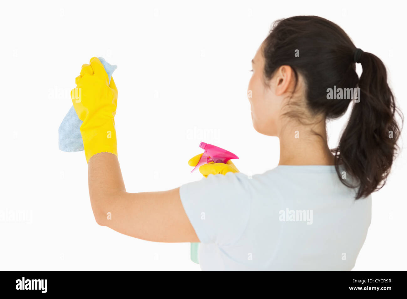 Woman cleaning white walls Stock Photo