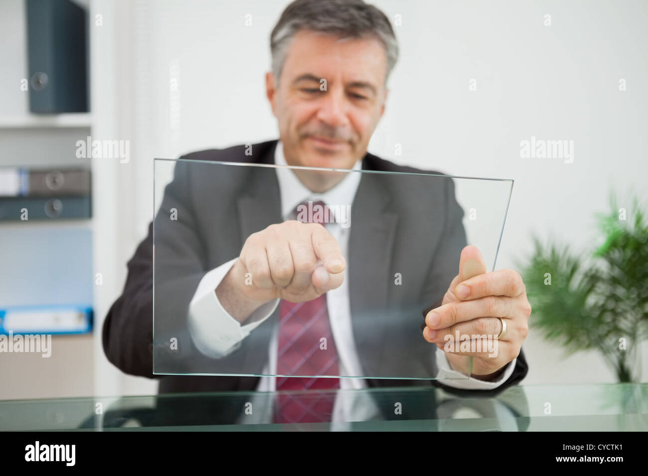 Happy man pointing on his virtual screen Stock Photo