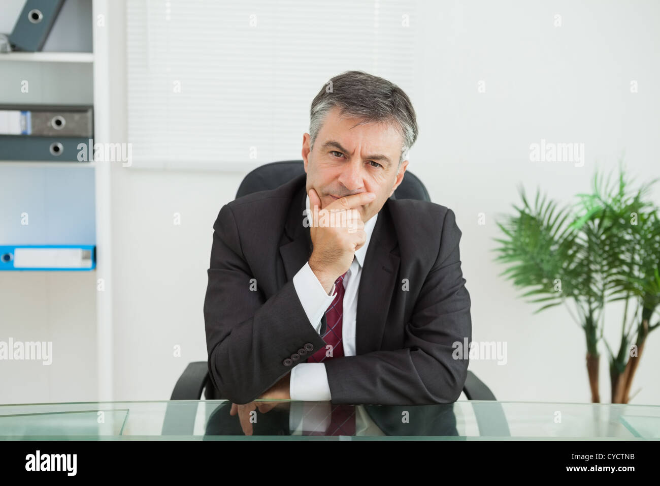 Businessman looking thoughtfully Stock Photo