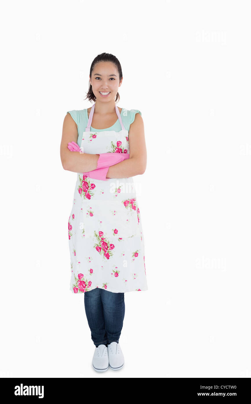 Woman wearing apron and rubber gloves Stock Photo