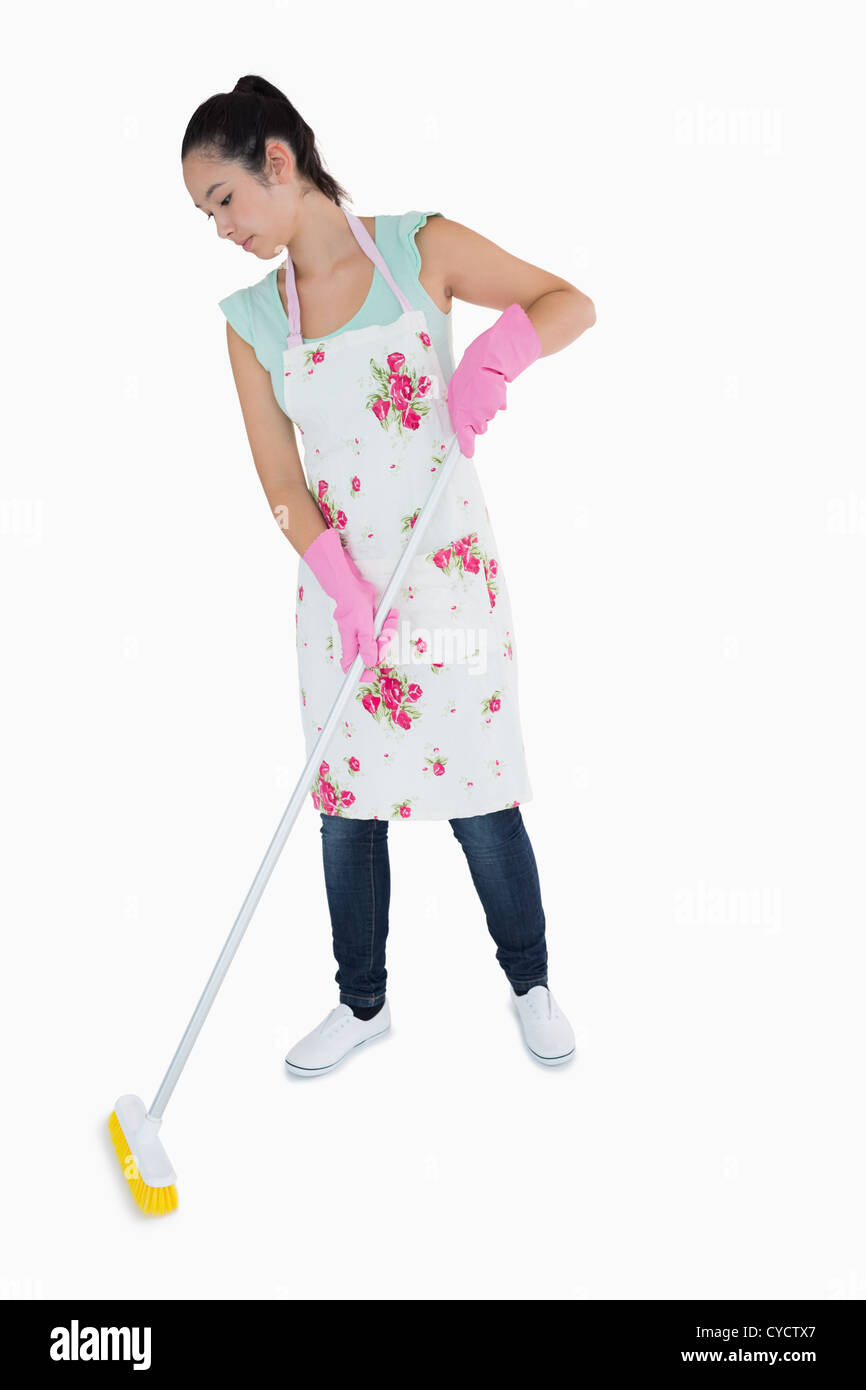 Woman sweeping floor Stock Photo