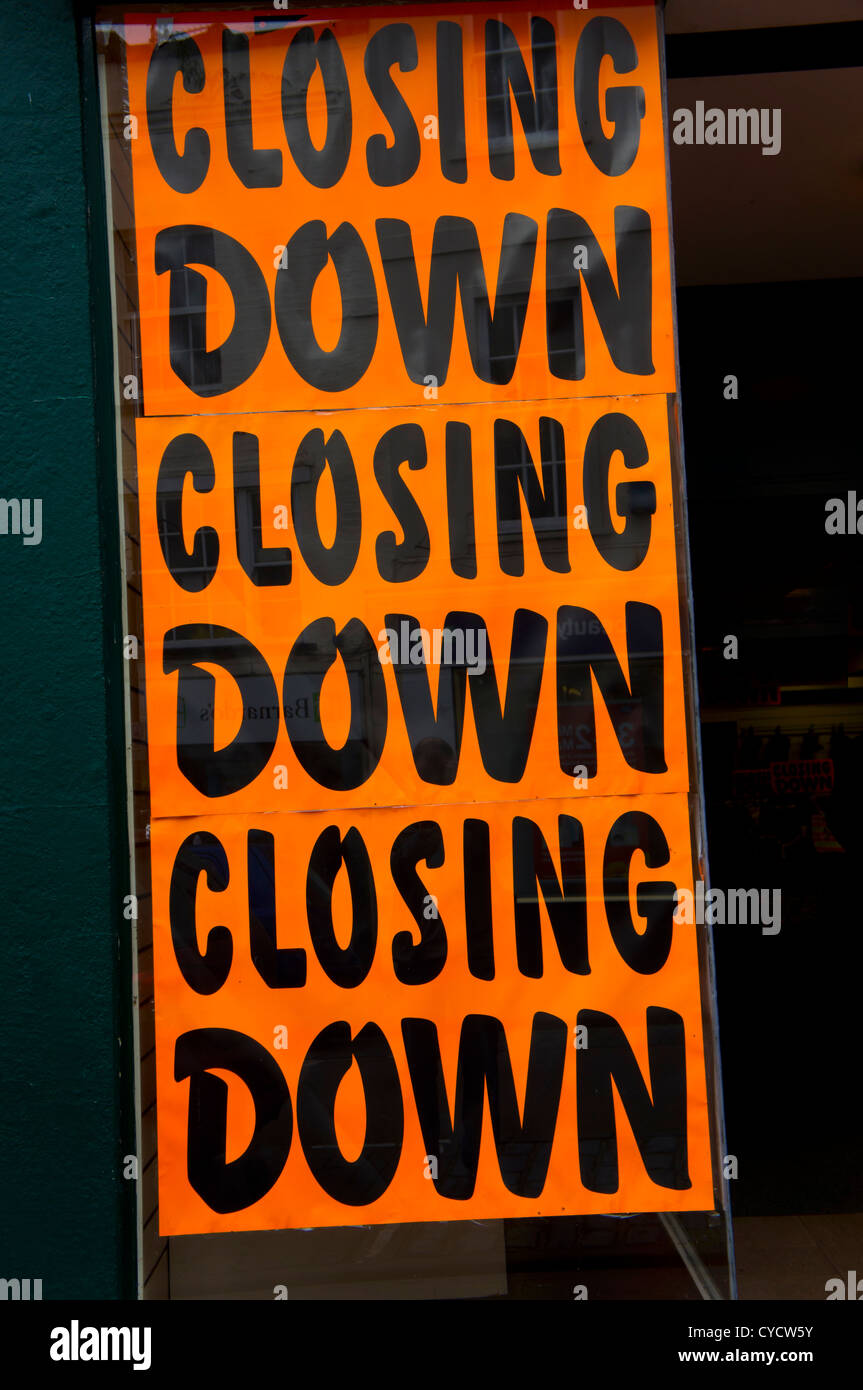 A closing down sale poster outside a high street shop Stock Photo