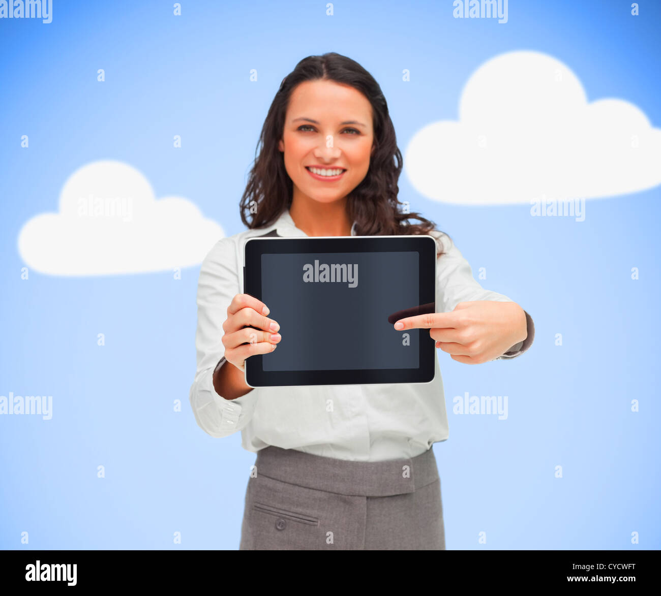 Businesswoman pointing to her digital tablet Stock Photo